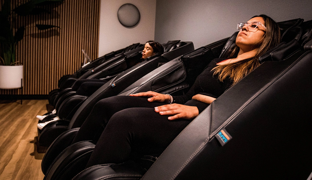 Woman sitting in a massage chair