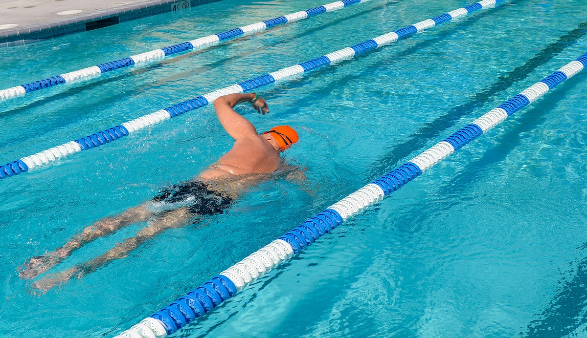 Man swimming laps outdoors