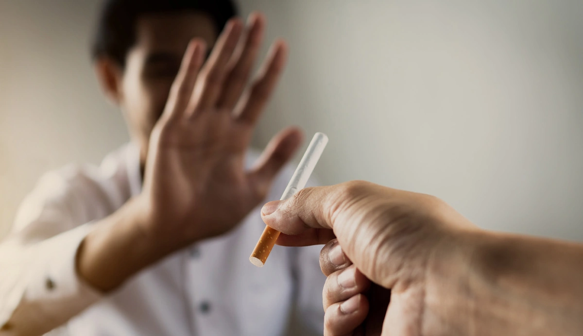 person refusing offered cigarette